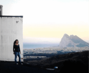 Megan with view of Gibraltar, after moving to Spain for the 2nd time.